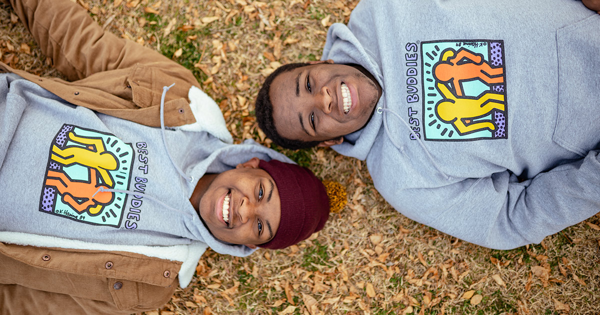 bbi-2021-black-history-month Two African American teenagers smiling in Best Buddies hoodies